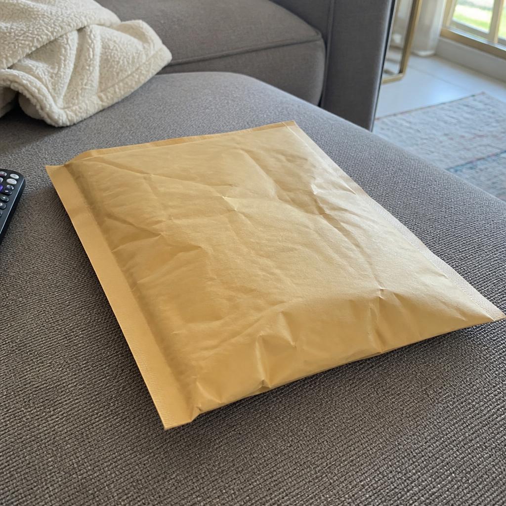 iPhone snapshot of a freshly delivered Discreet Mafia package on a Seattle entryway floor, customer photo from Noah