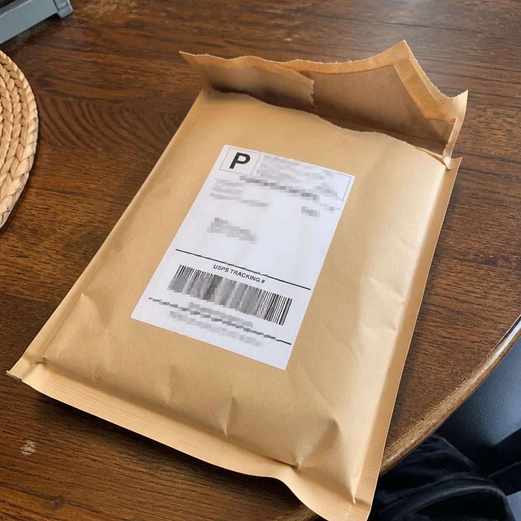 Sealed Discreet Mafia order resting on a marble table, customer photo from Priya in Toronto
